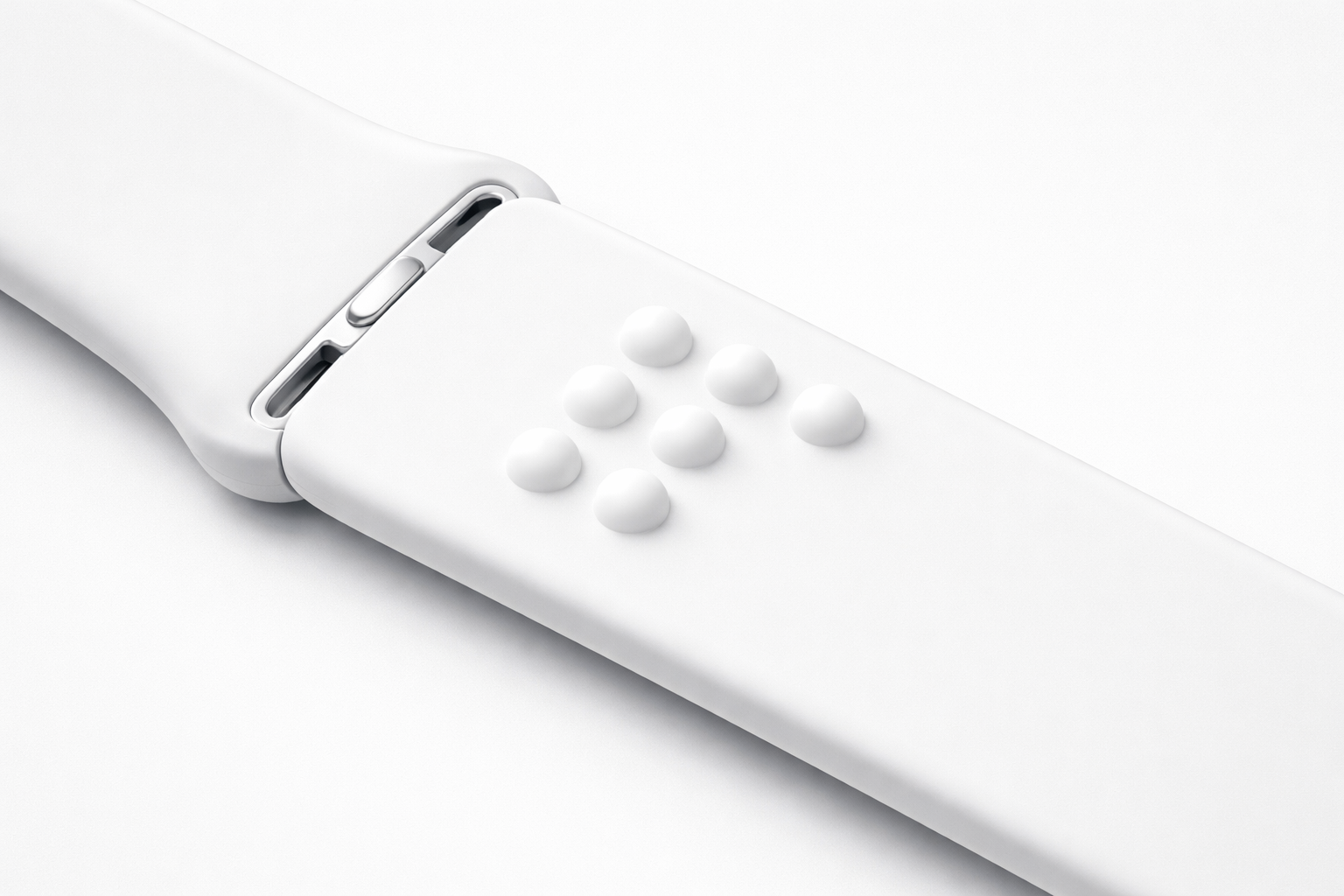 Konceptbild: vitt Apple Watch-armband med upphöjda punktskriftsprickar