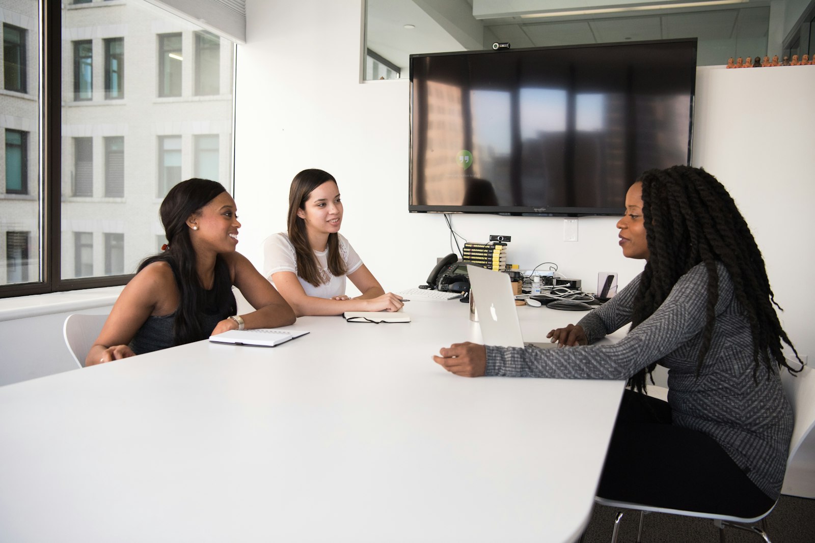 Three colleagues in a job interview at an office table