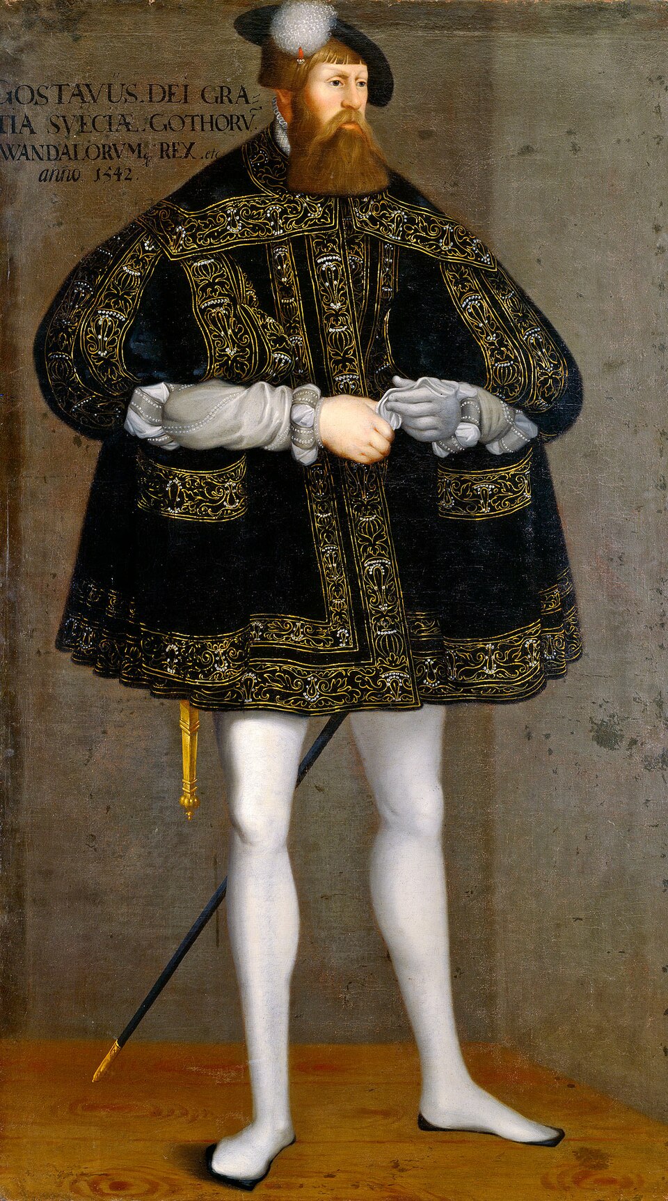 Målat helfigursporträtt av Gustav Vasa från 1542 i svart guldbroderad dräkt och basker, med långt rödbrunt skägg.