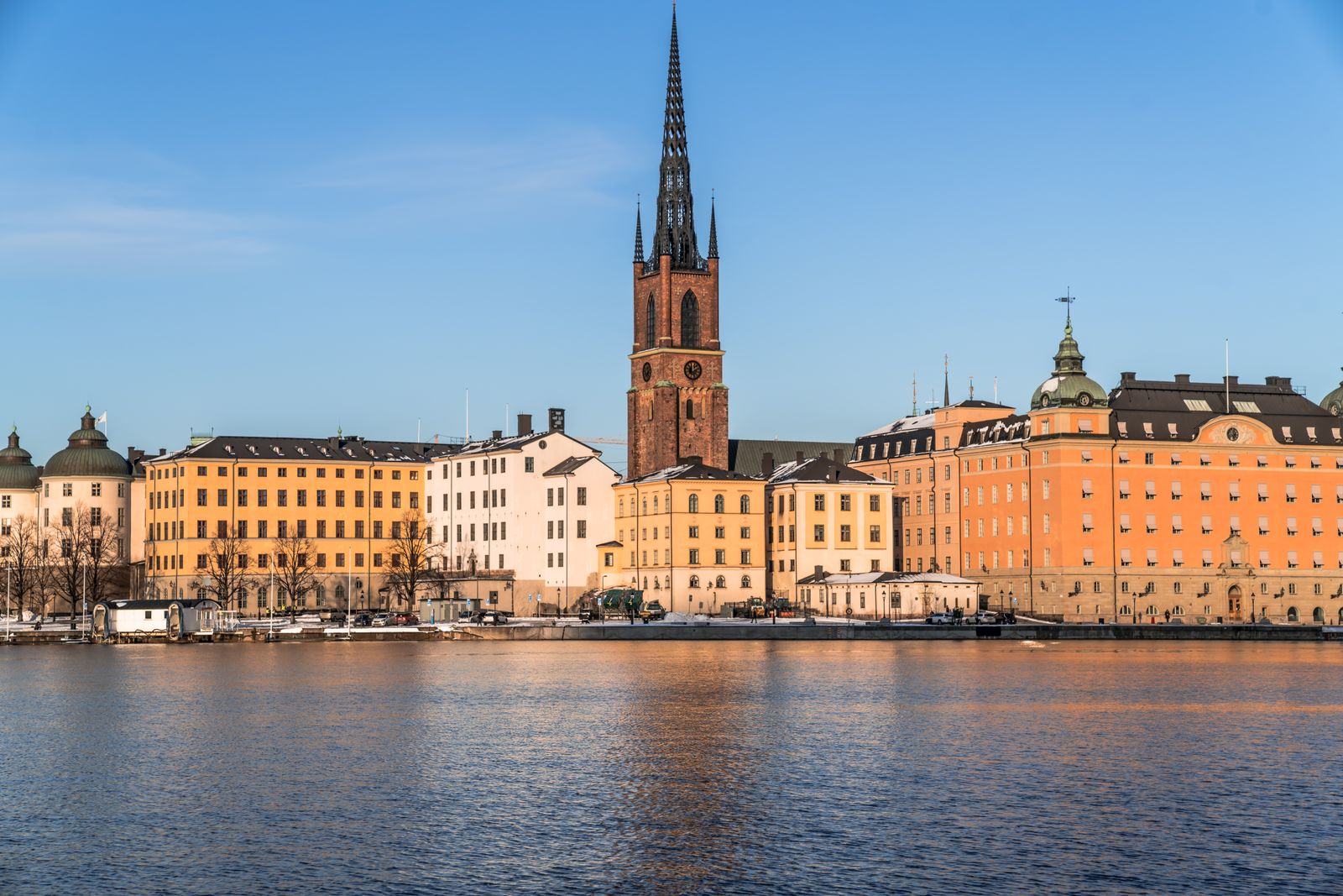 Riddarholmen Church and the Stockholm waterfront at golden hour