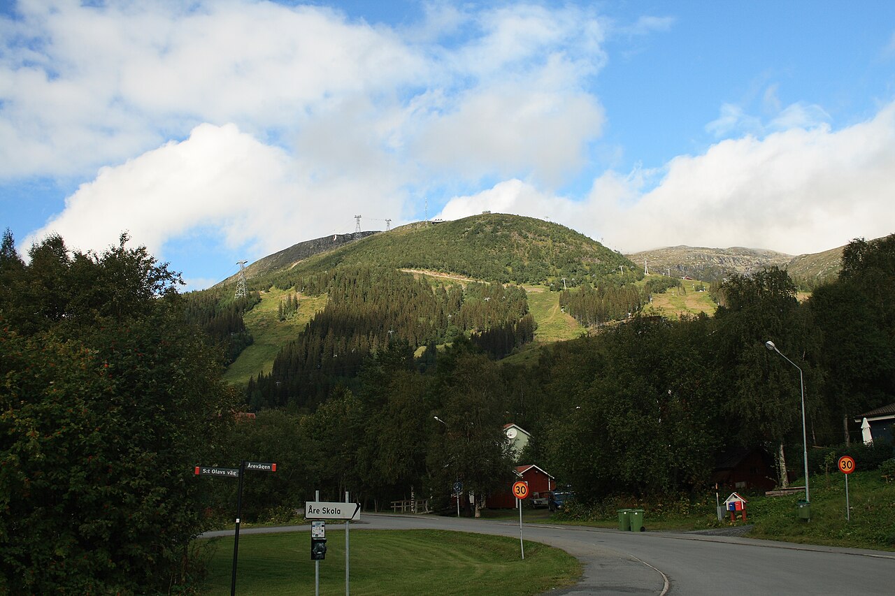 The green summer slopes of the mountain Areskutan rising above the village of Are