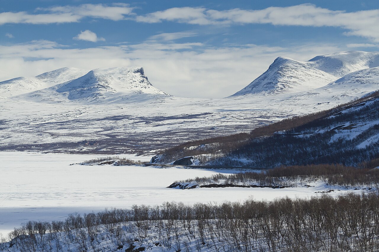 The distinctive U-shaped valley of Lapporten framed by snow-capped fells near Abisko