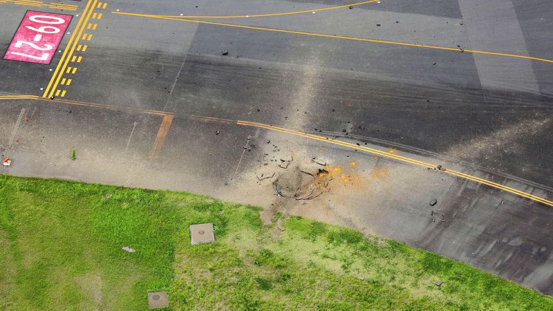 american-wwii-bomb-explodes-at-japanese-airport,-causing-large-crater-in-taxiway