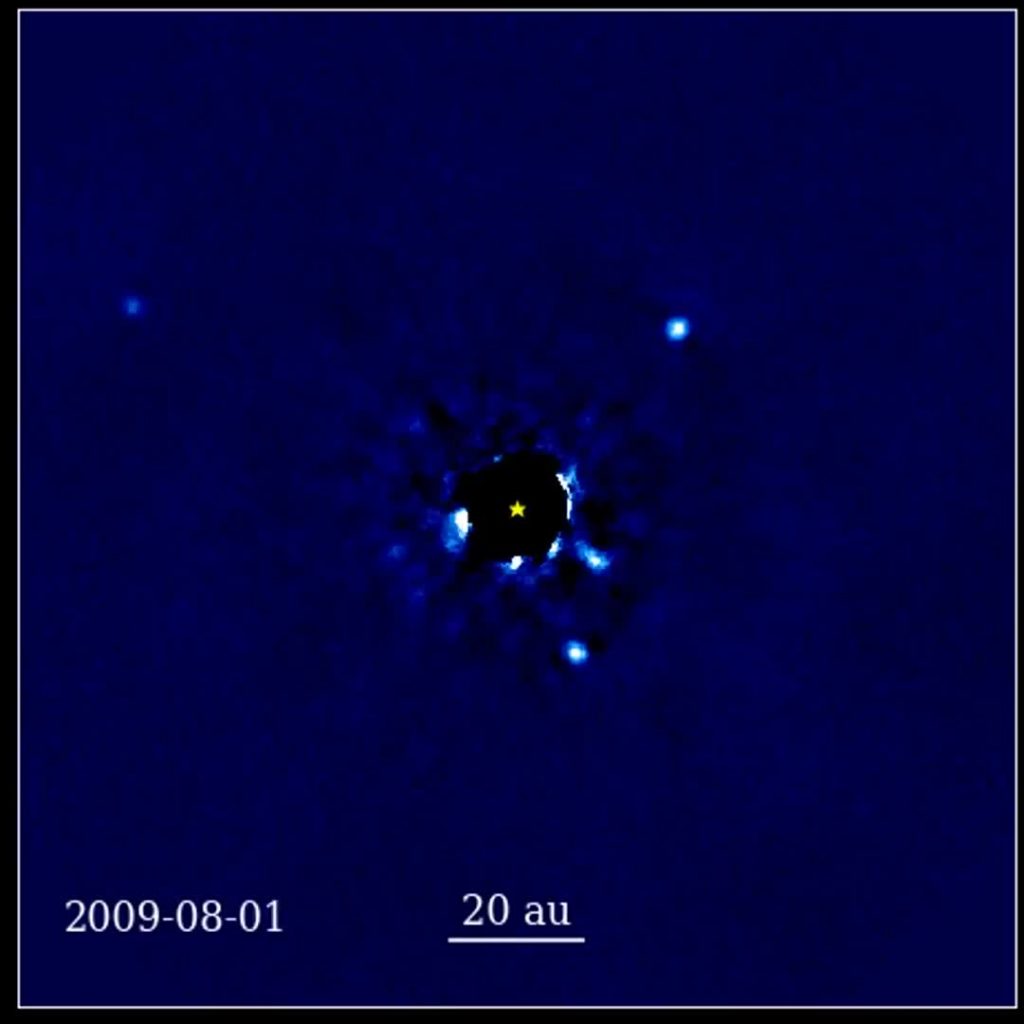 a-12-year-sequence-of-telescope-images-of-a-star-and-four-planets-orbiting